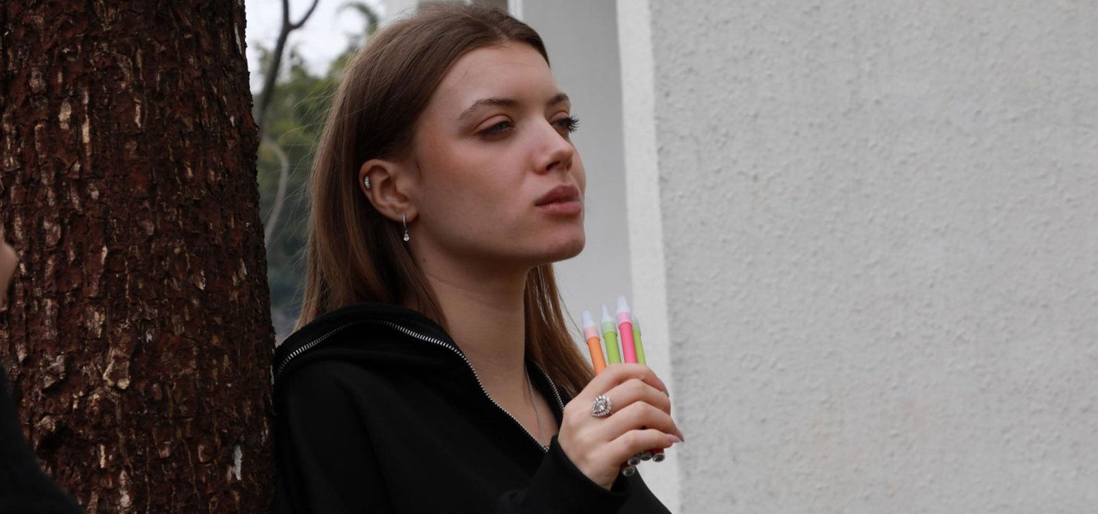 Adult using a Coofeel herbal diffuser pen